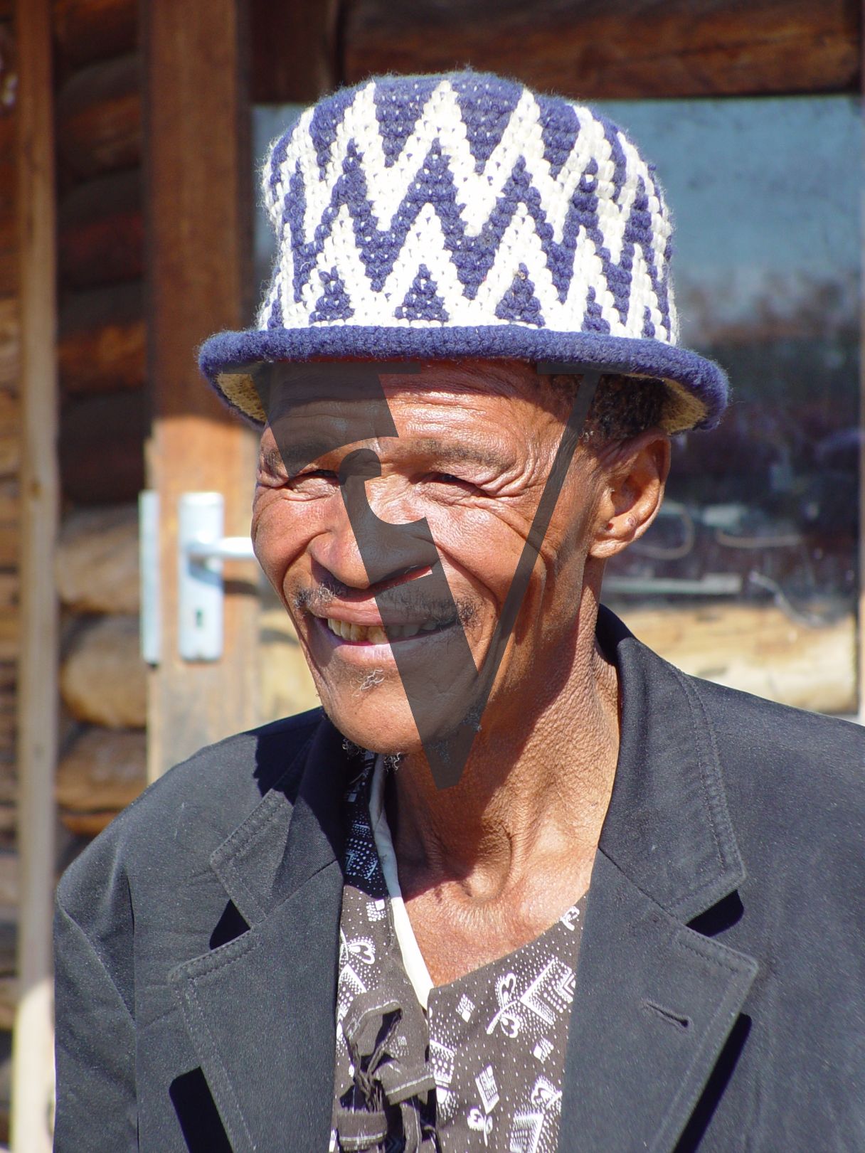 N!Xau, the “Bushman”, portrait, smiling.