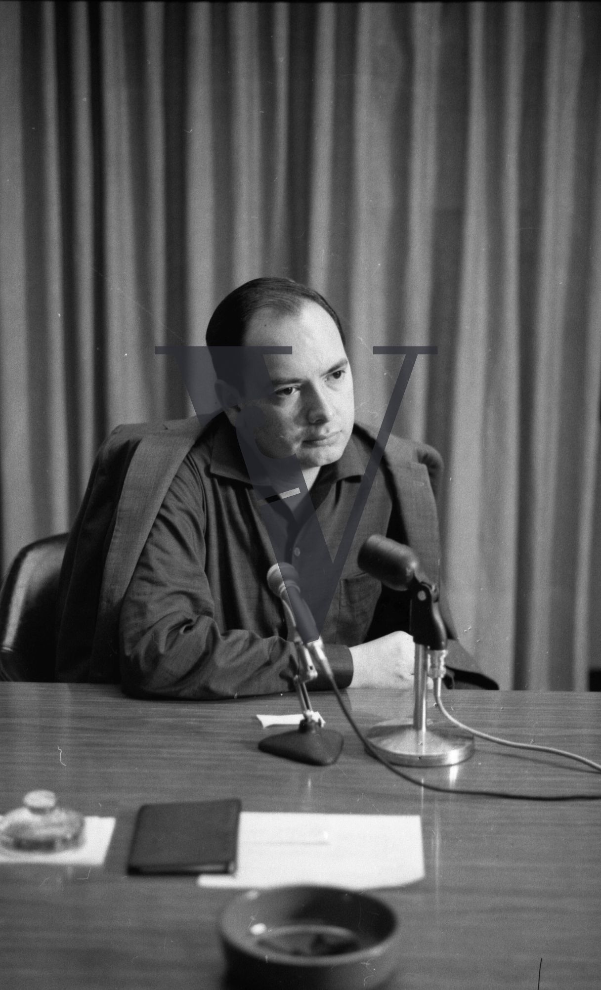 Cuba, portrait, Alfredo Guevara, at microphone, Instituto Cubano del Arte e Industria Cinematográficos.