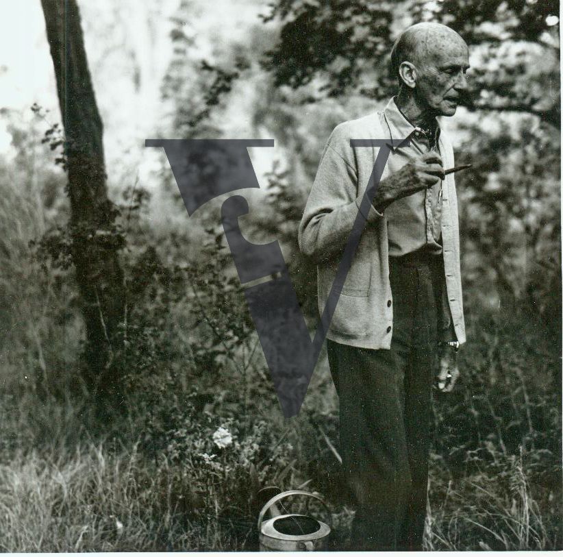 Writer Spud Johnson, Taos, New Mexico, portrait, eyes closed, pipe.