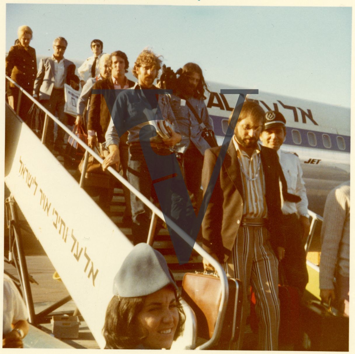 The Gospel Road, production stills, Johnny Cash, crew coming down aeroplane steps.