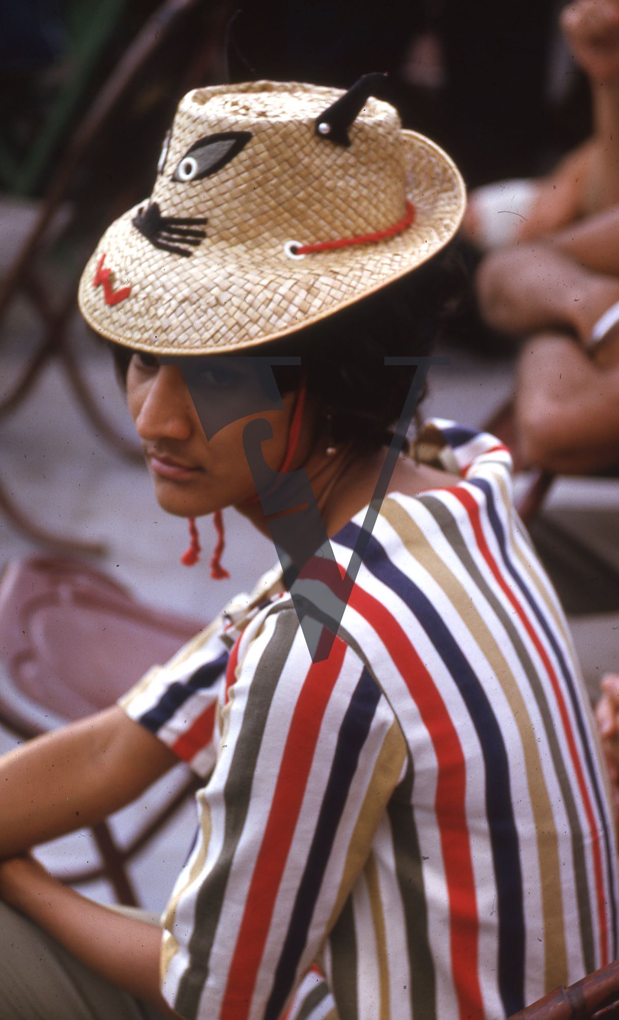 Jamaica, Woman at carnival in cat hat.