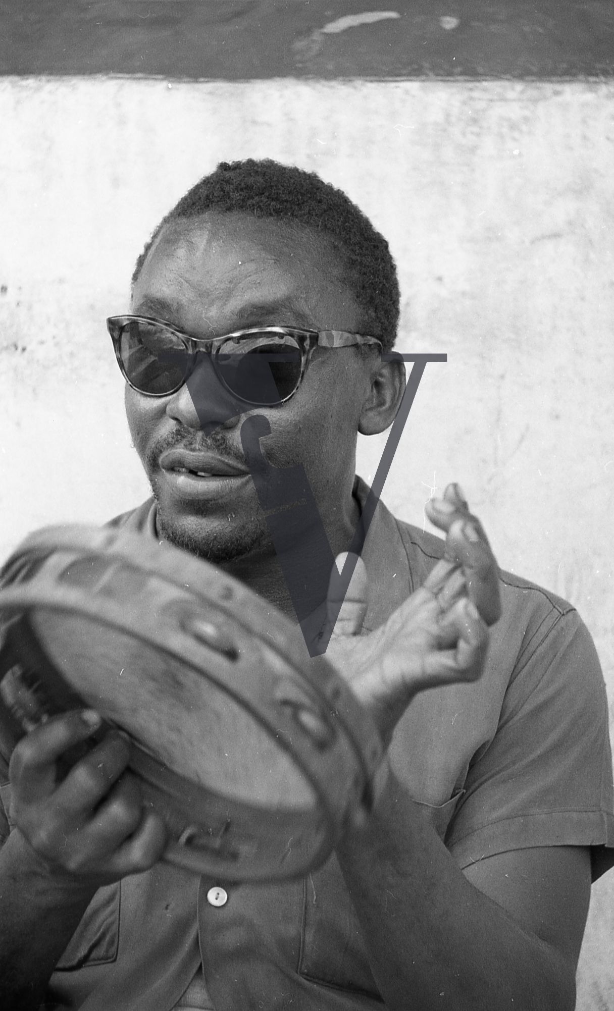 Jamaica, Roy Richards, Studio One reggae artist, plays tambourine.