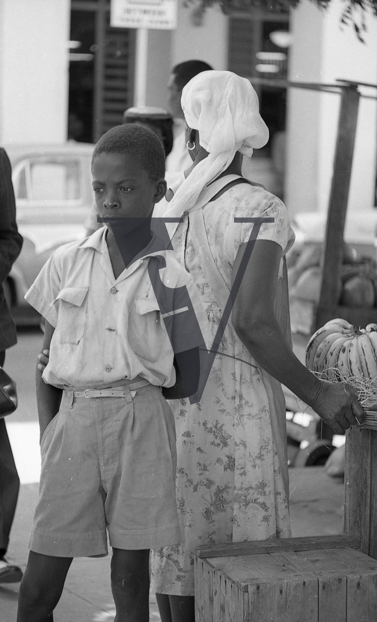 Jamaica, Boy on street lost in thought.